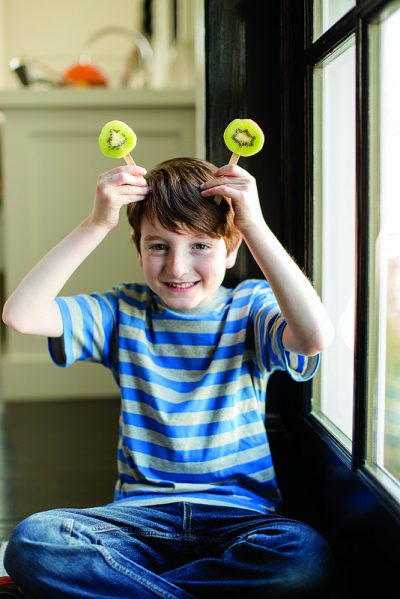 kiwisicles_lifestyle boy holding kiwisicles